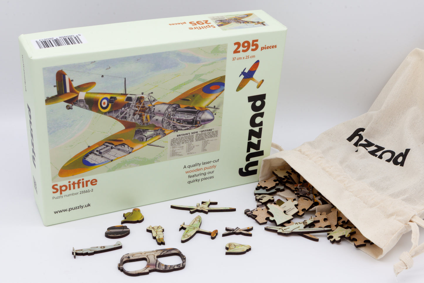 A wooden jigsaw puzzle depicting a 1940's Britain's new 'Spitfire' airplane with an exploded view plan.