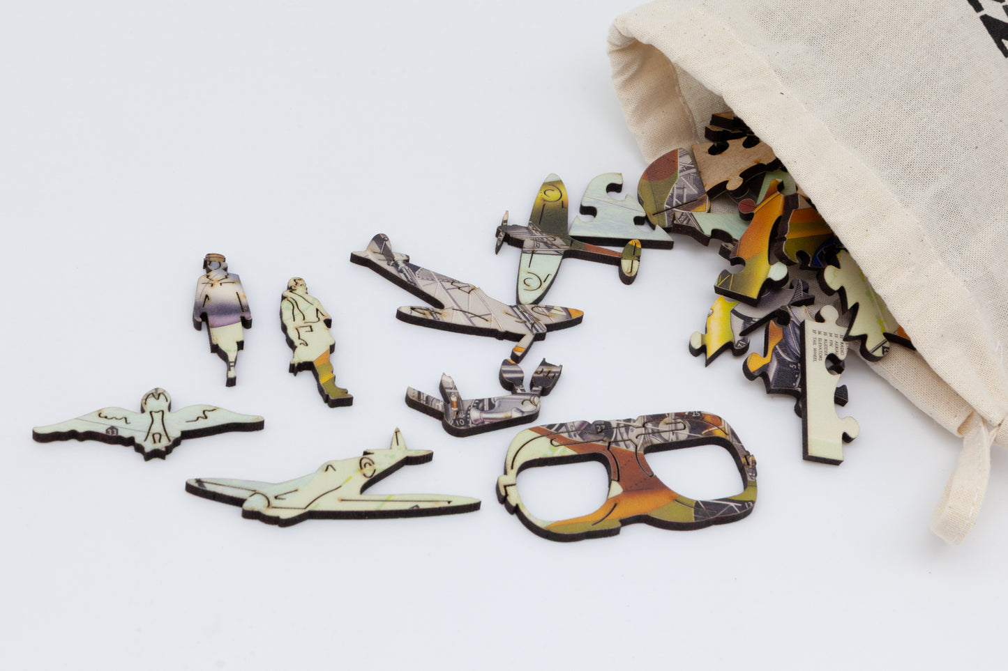 A wooden jigsaw puzzle depicting a 1940's Britain's new 'Spitfire' airplane with an exploded view plan.
