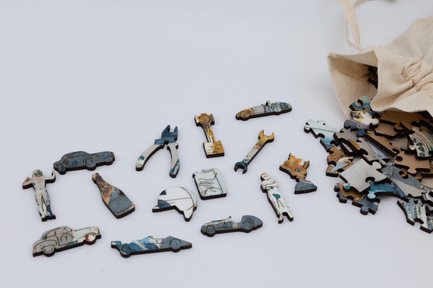 The Pit Stop Wooden Jigsaw Puzzle by The Puzzly Company. Artwork by June Lloyd. It's a wonderful 1950's inspired Motorsport Grand Prix race. The puzzle contains both normal and whimsical jigsaw pieces. Made in Britain.