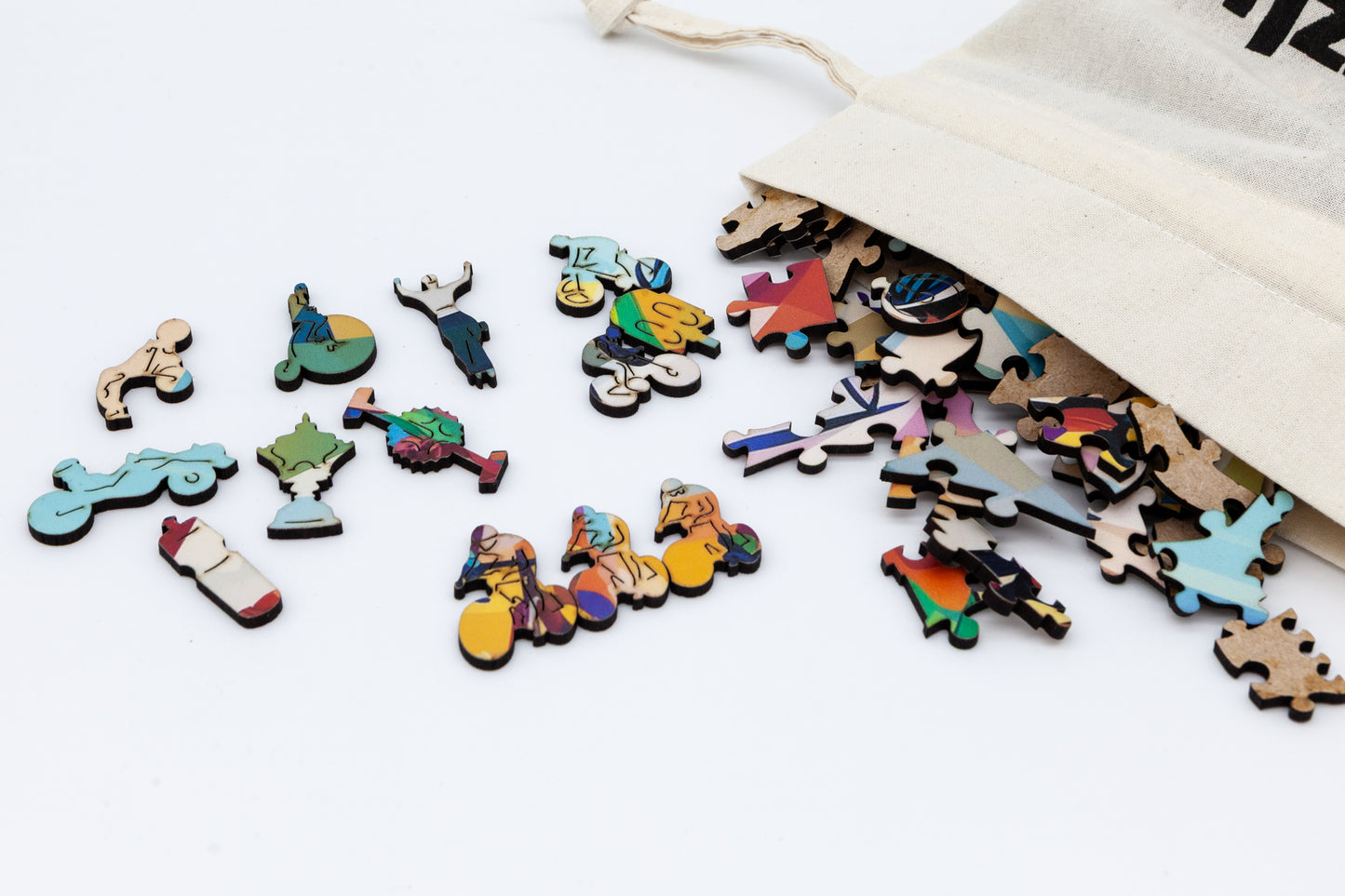 Cyclists wooden jigsaw puzzle. Artwork by the Puzzly Company. A fun cycling puzzle with lots of bicycle and racing themed puzzle pieces. 264 or 130 pieces. The perfect puzzle for a cyclist. Made in Britain using sustainable materials.