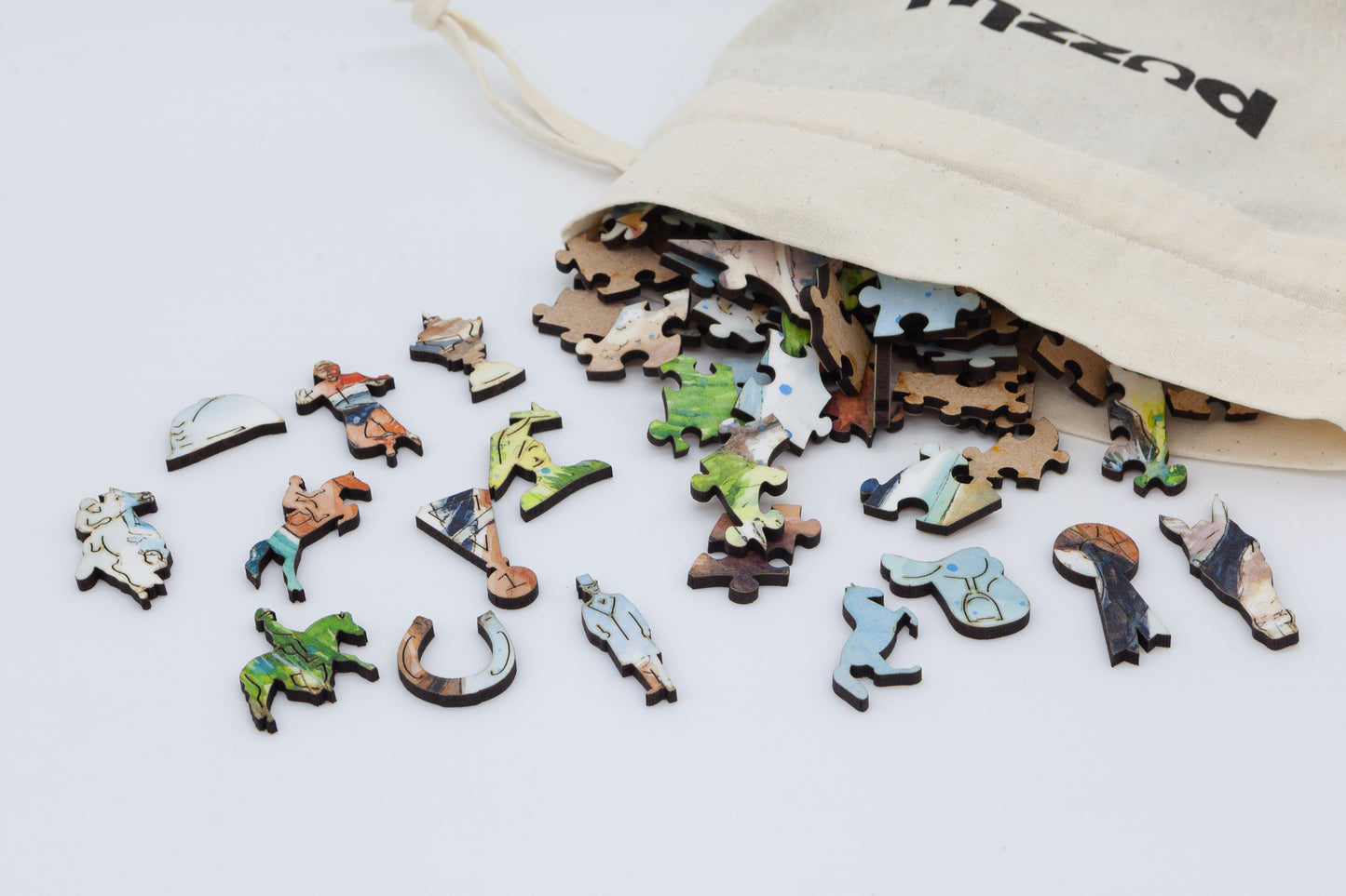 The Horse Race Wooden Jigsaw Puzzle by The Puzzly Company. Artwork by June Lloyd. A fun filled puzzle with regular and whimsical pieces. Made in Britain.
