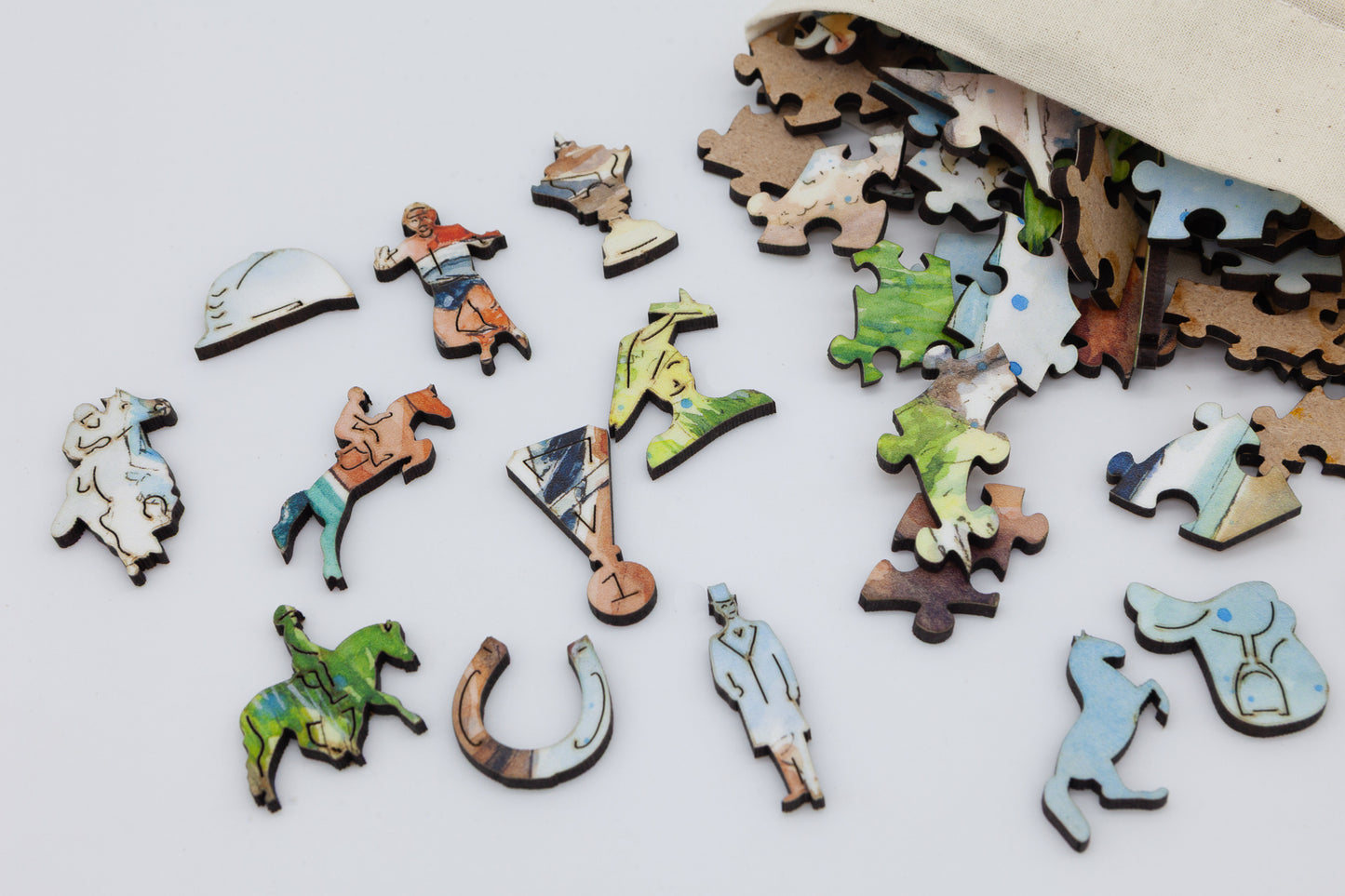 The Horse Race Wooden Jigsaw Puzzle by The Puzzly Company. Artwork by June Lloyd. A fun filled puzzle with regular and whimsical pieces. Made in Britain.