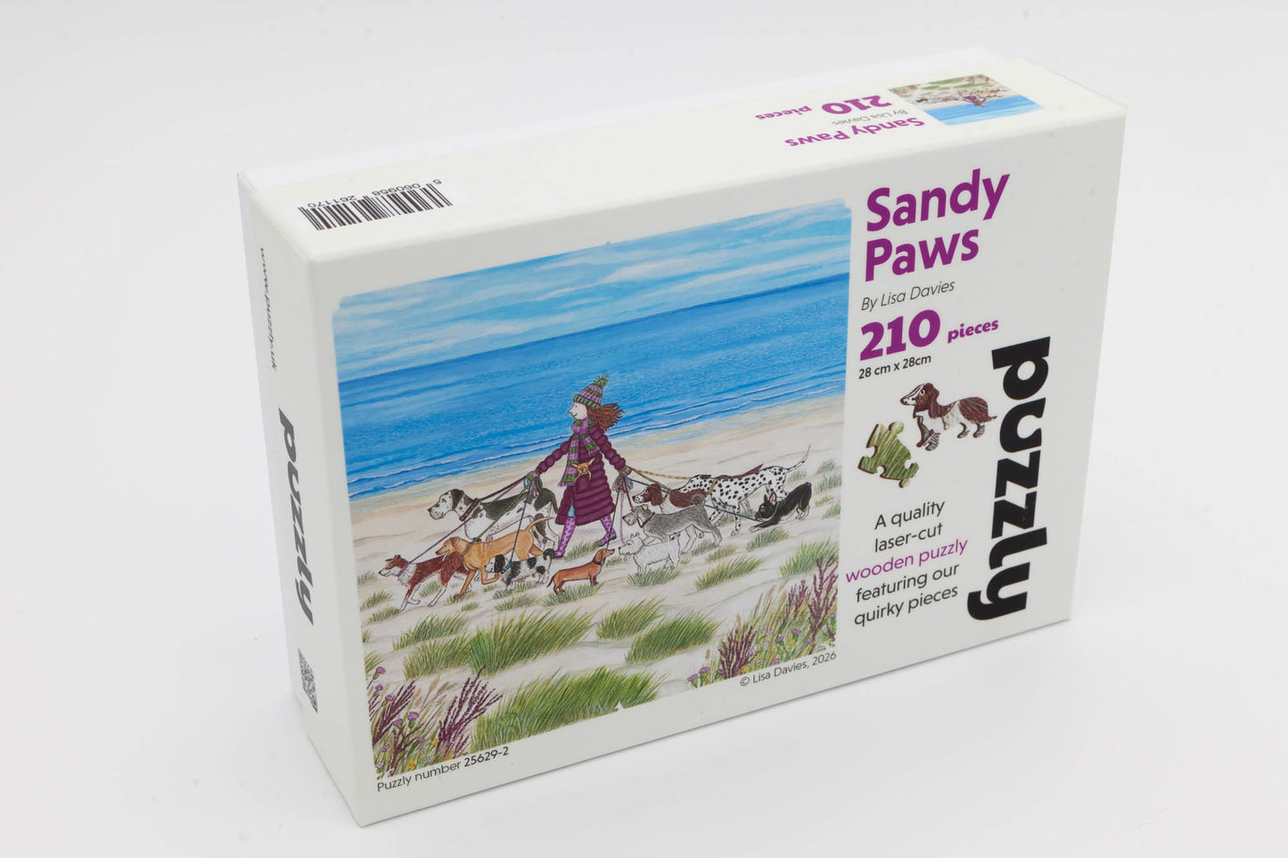 Sandy Paws Wooden Jigsaw Puzzle. Original artwork by Lisa Davies. 210 dog themed and irregular jigsaw pieces. Made in Britain by The Puzzly Company.