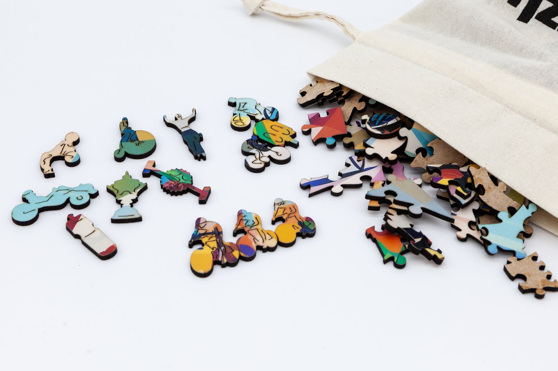 Cyclists wooden jigsaw puzzle.  Artwork  by the Puzzly Company.  A fun cycling puzzle with lots of bicycle and racing themed puzzle pieces.  264 or 130 pieces.  The perfect puzzle for a cyclist. Made in Britain using sustainable materials.