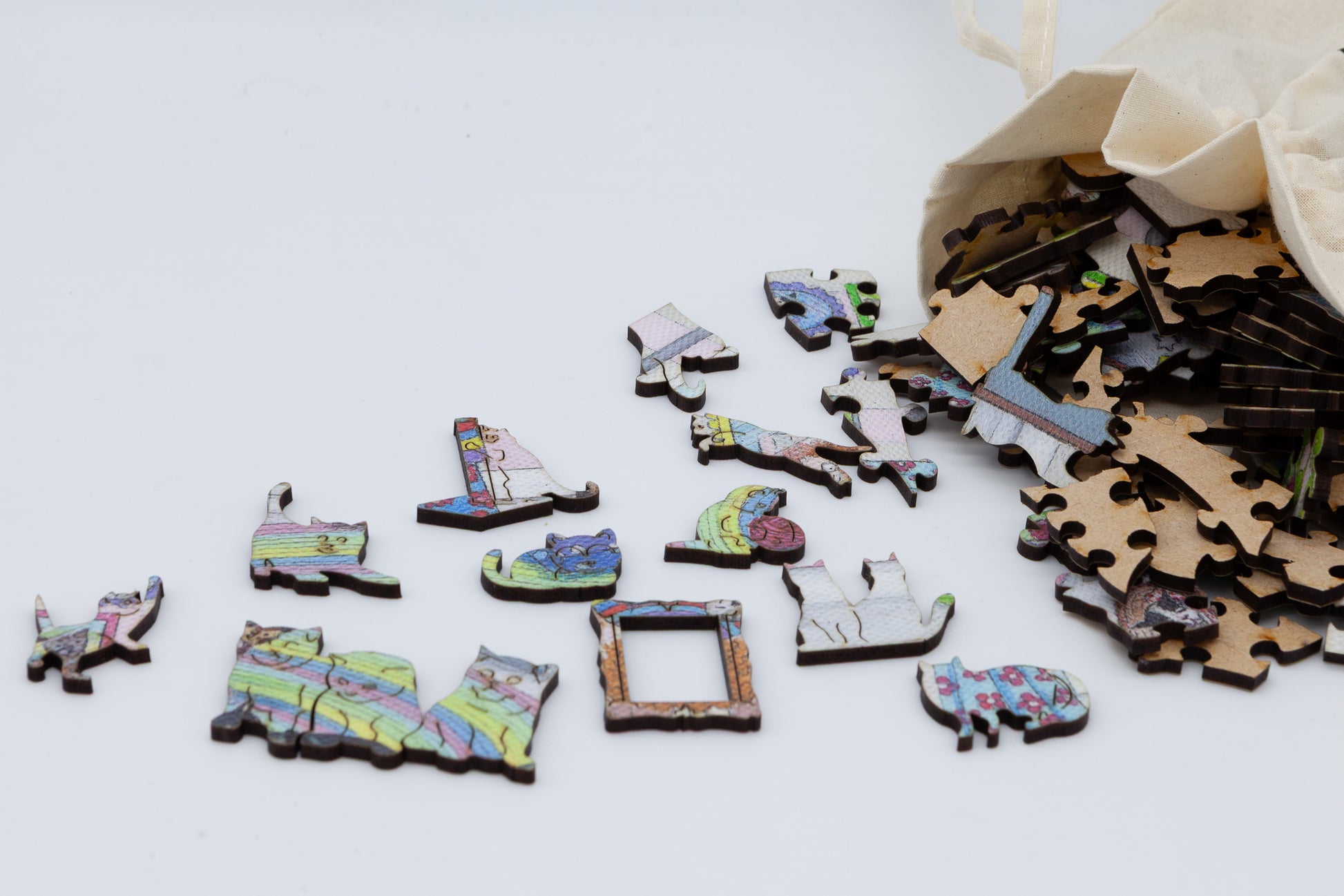 The Mad Cat Lady Wooden Jigsaw Puzzle is a fun painting by Lisa Davies that is full of cats.  The puzzle has 200 pieces including lots of cat themed puzzle pieces.