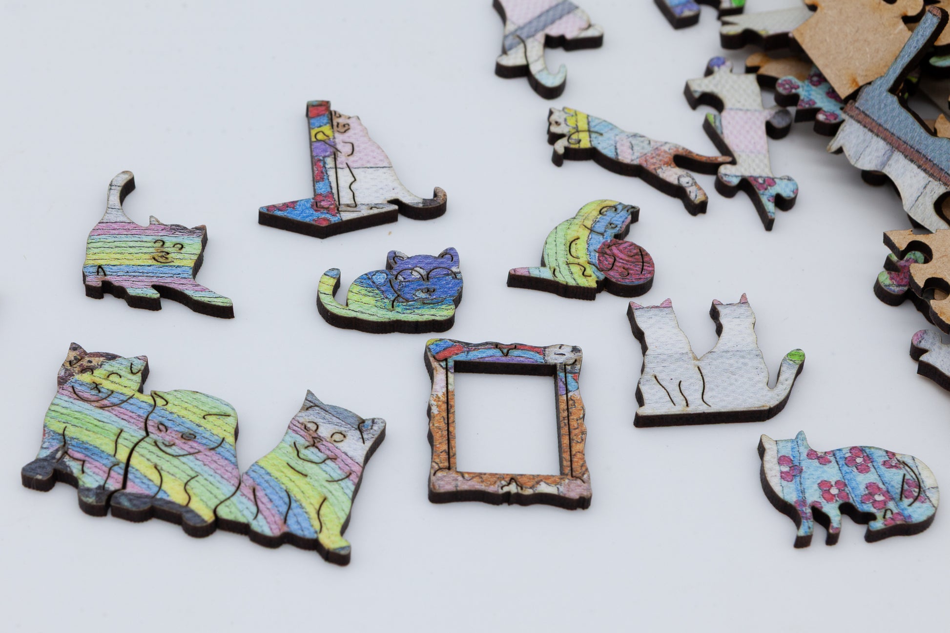 The Mad Cat Lady Wooden Jigsaw Puzzle is a fun painting by Lisa Davies that is full of cats.  The puzzle has 200 pieces including lots of cat themed puzzle pieces.
