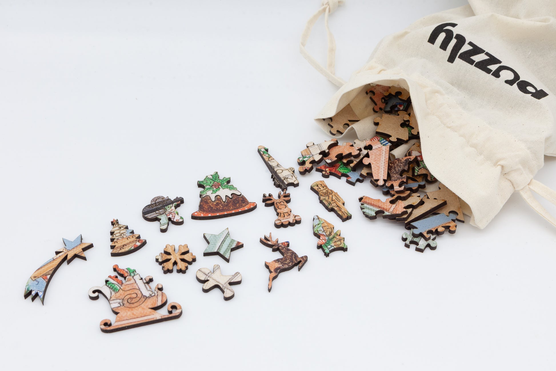 A Christmas wooden jigsaw featuring Lisa Davies 'All Hail the Christmas Puddling'.  A quality wooden jigsaw puzzle by the Puzzly Company.