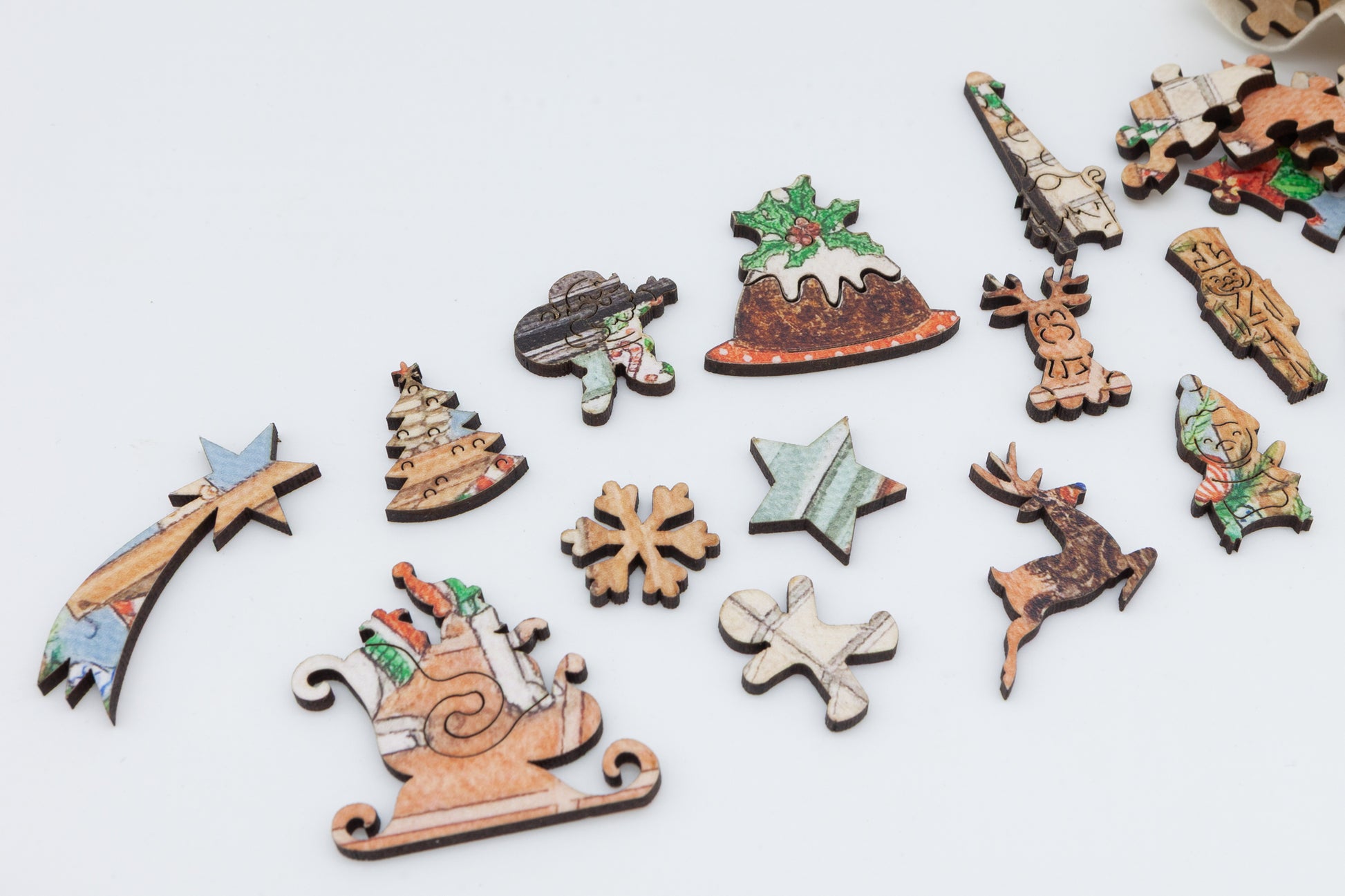 A Christmas wooden jigsaw featuring Lisa Davies 'All Hail the Christmas Puddling'.  A quality wooden jigsaw puzzle by the Puzzly Company.
