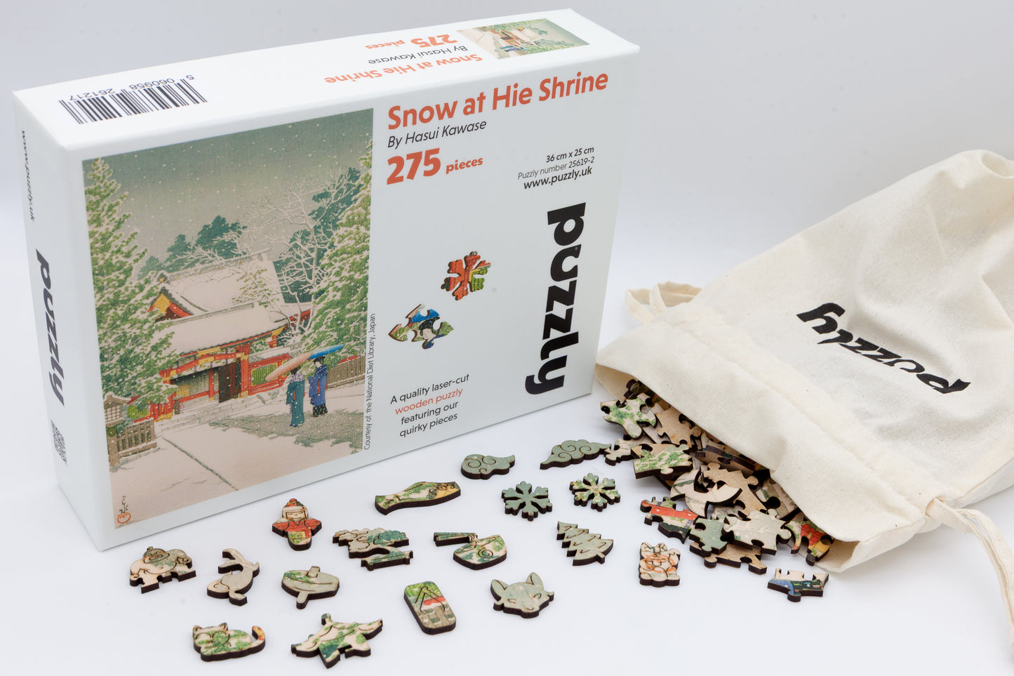 Snow at Hie Shrine wooden jigsaw puzzle.  Contains 275 jigsaw pieces.  Artwork by Hasui Kawase.  With irregular shaped and themed whimsical pieces. 