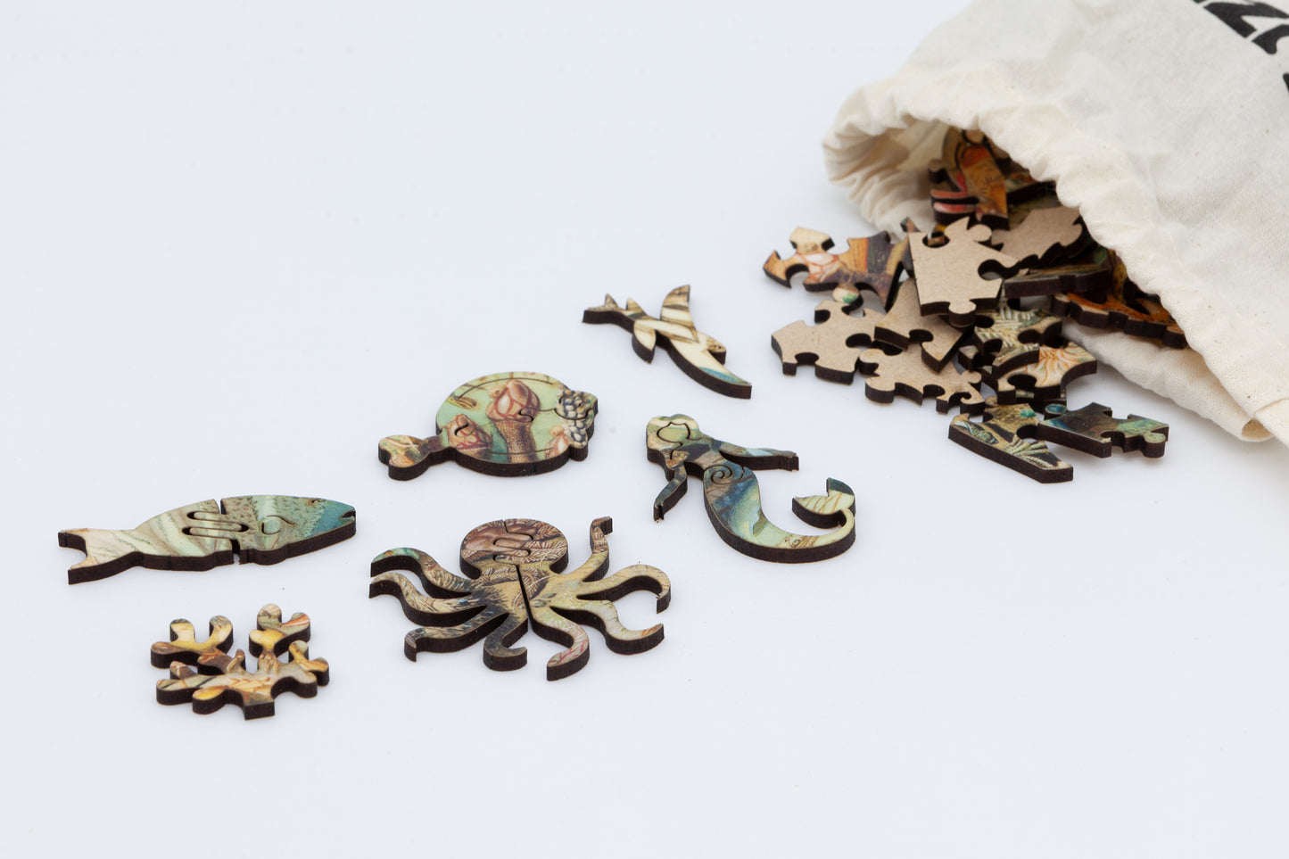 Ocean Life wooden jigsaw puzzle.  3 sizes available.  Full of sea creature themed jigsaw pieces.  Crafted in Britain by the Puzzly Company.