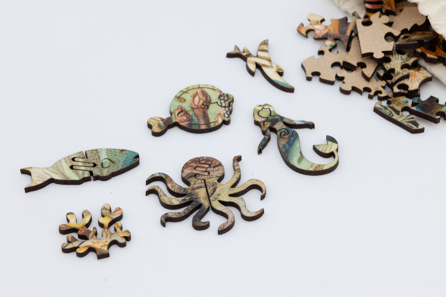 Ocean Life wooden jigsaw puzzle.  3 sizes available.  Full of sea creature themed jigsaw pieces.  Crafted in Britain by the Puzzly Company.