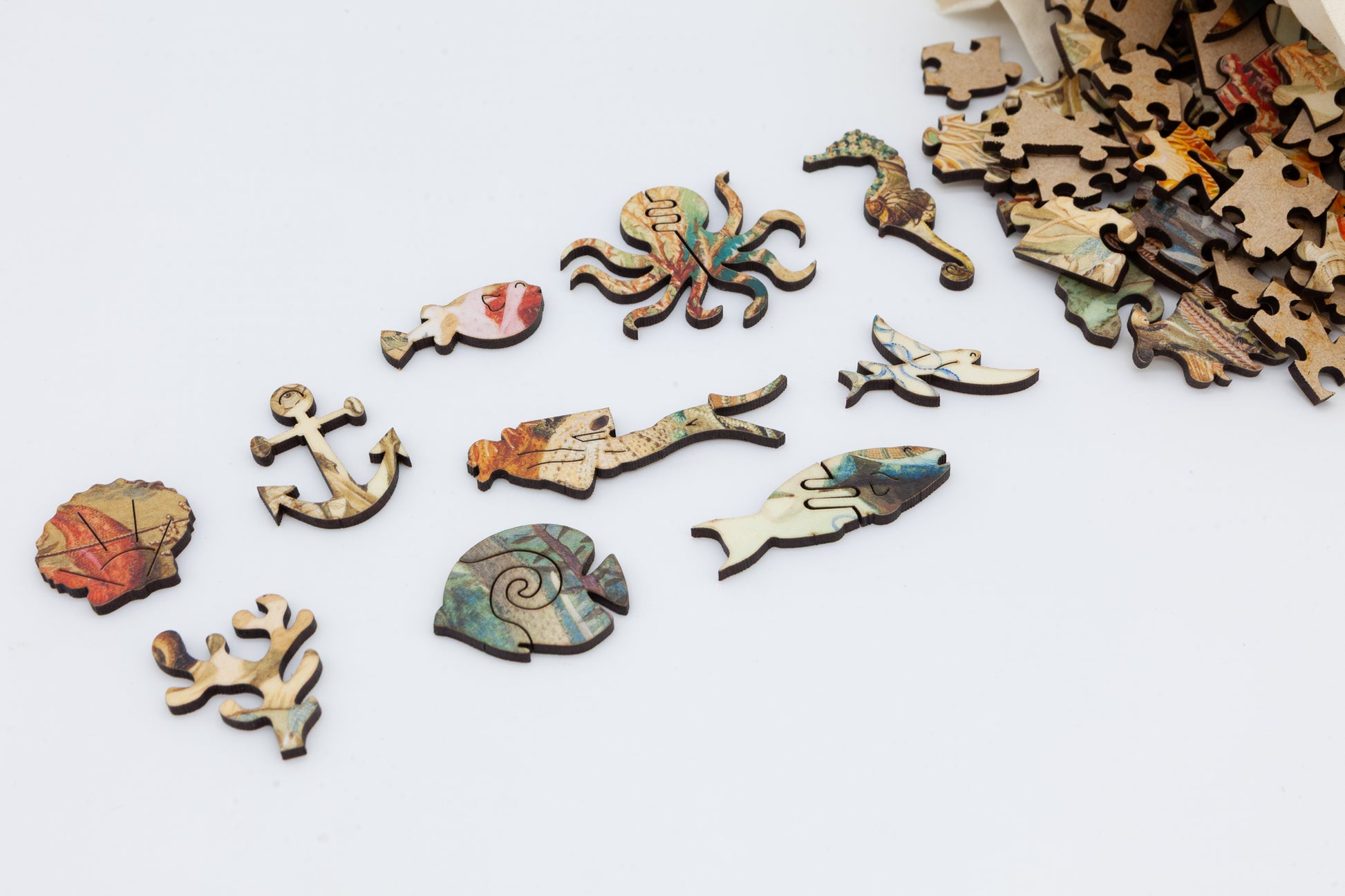 Ocean Life wooden jigsaw puzzle.  3 sizes available.  Full of sea creature themed jigsaw pieces.  Crafted in Britain by the Puzzly Company.