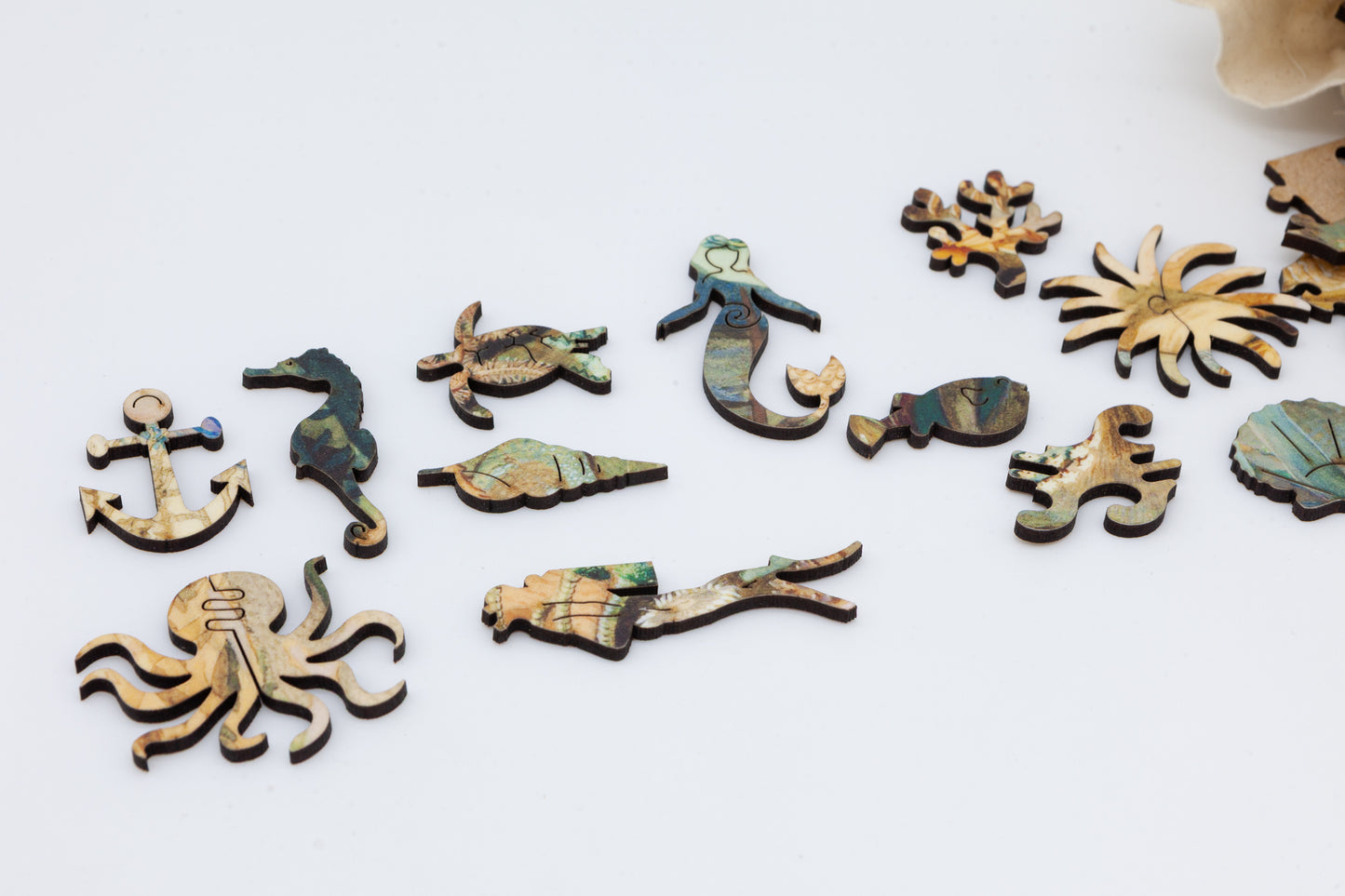 Ocean Life wooden jigsaw puzzle.  3 sizes available.  Full of sea creature themed jigsaw pieces.  Crafted in Britain by the Puzzly Company.