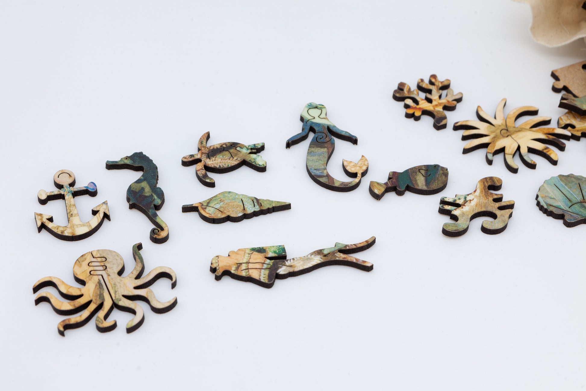 Ocean Life wooden jigsaw puzzle.  3 sizes available.  Full of sea creature themed jigsaw pieces.  Crafted in Britain by the Puzzly Company.