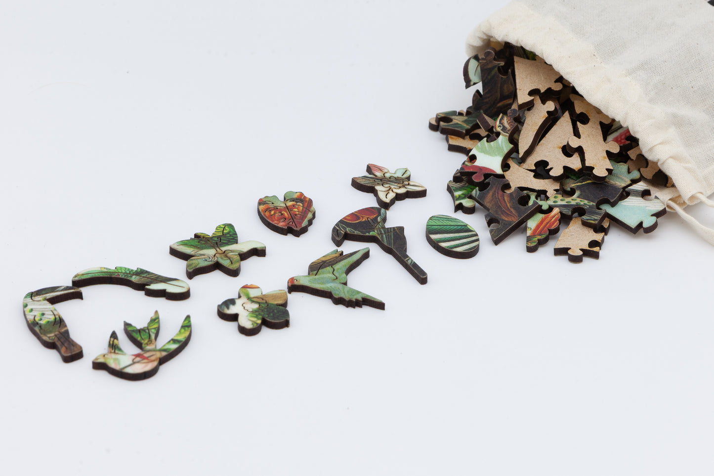 Hummingbirds wooden jigsaw puzzle.  3 sizes to chose from.  Whimsical and irregular shaped pieces.  Made in Britain by The Puzzly Company.