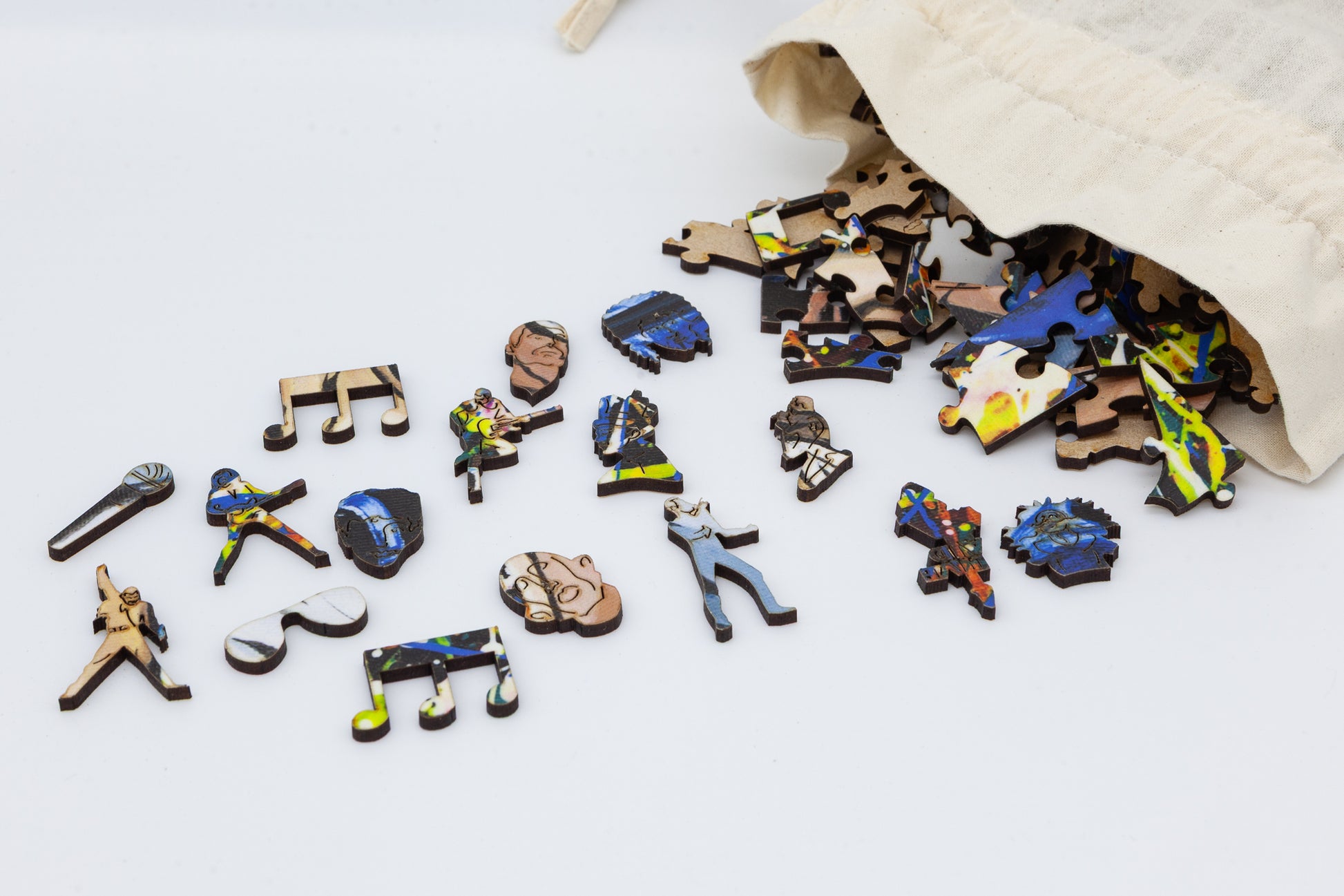 Freddie Mercury Wooden Jigsaw Puzzle.  Contains wonderful Freddie and Queen related character pieces.  Made in Britain by The Puzzly Company