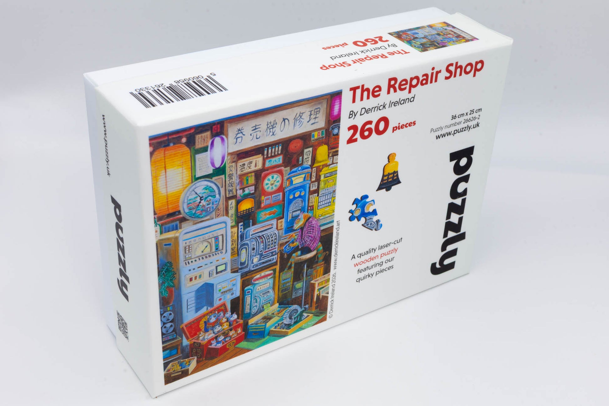 The Repair Shop wooden Jigsaw Puzzle.  Artwork by Derrick Ireland.  A mythical Japanese scene of a repair shop run by a chameleon.  Contains irregular and whimsical jigsaw pieces.  Made in Britian. 